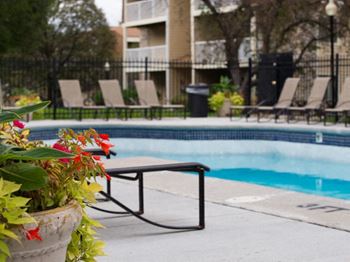 Outdoor, heated swimming pool with sundeck